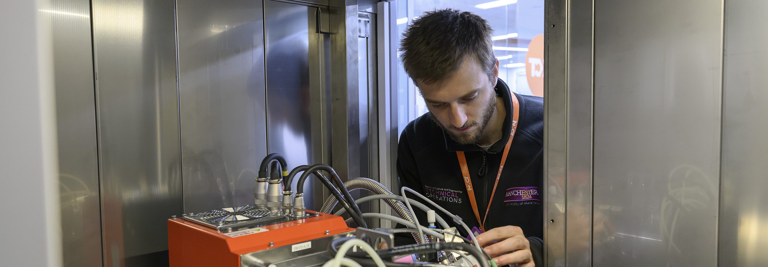 NXCT_Lab367 A technician adjusts the rig inside an XCT machine